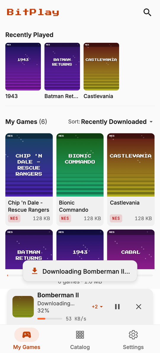 The download dock showing a game downloading above the navigation bar.